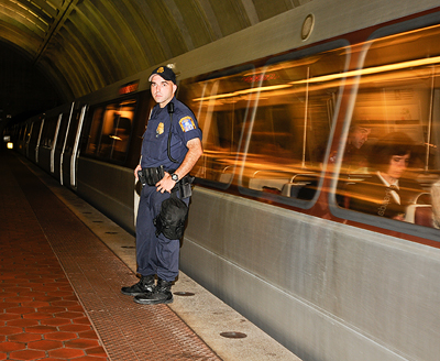 MTPD officer patrols Metro station.