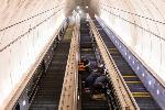 Crews work on the escalators at the Wheaton Metrorail station.