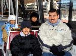 Family members enjoy traveling on a Metrorail car along the Blue Line.