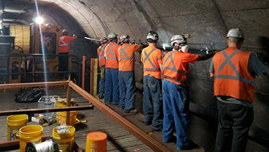 Cellular Service Cable Installation Crew in Tunnel