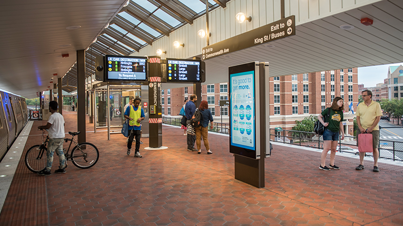 Metrorail platform with customers and new digital screens