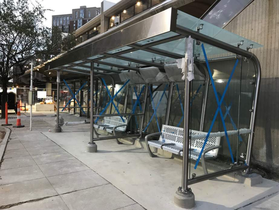 Eisenhower Ave – windscreens and benches are set along the permanent bus loop